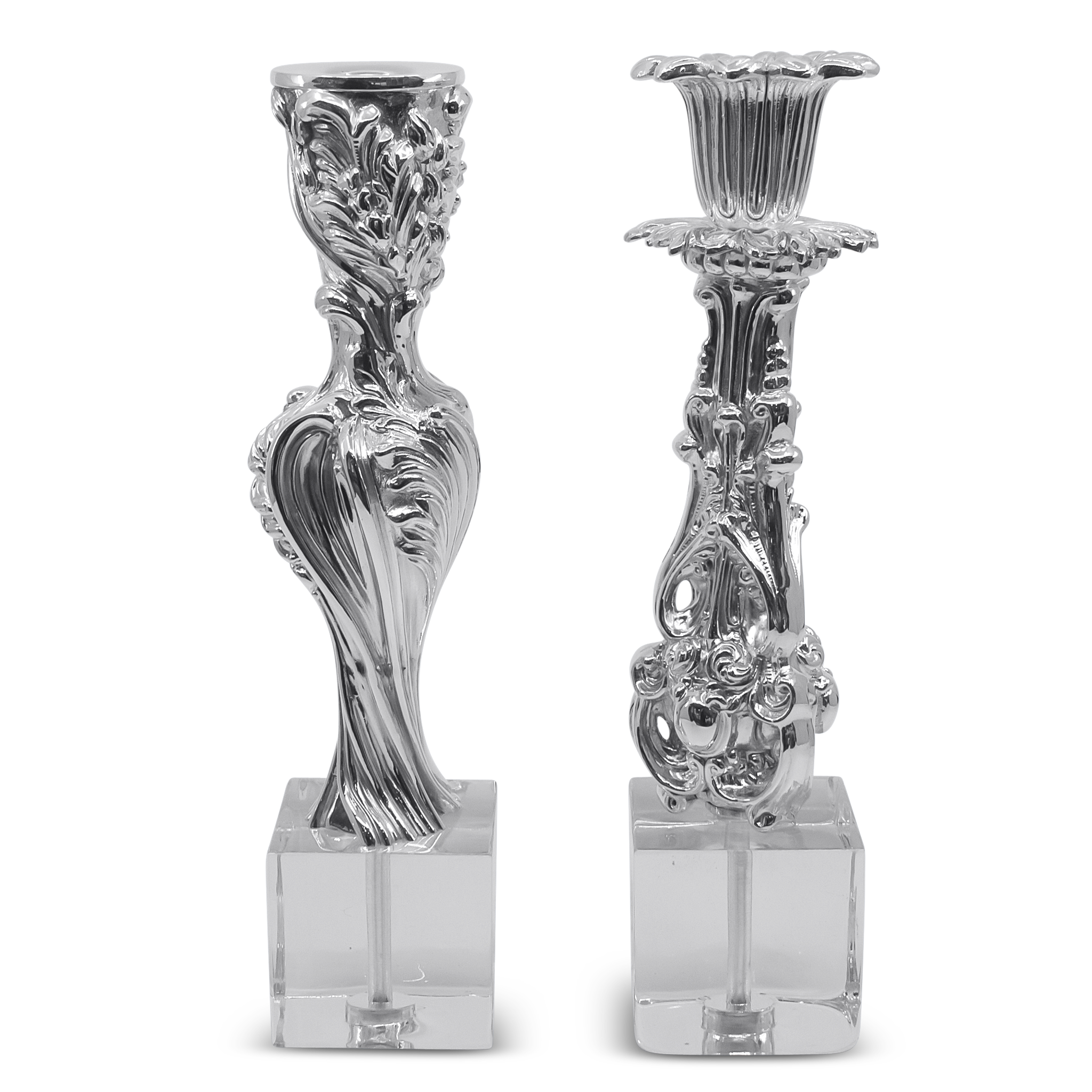 Two ornate silver candle holders 